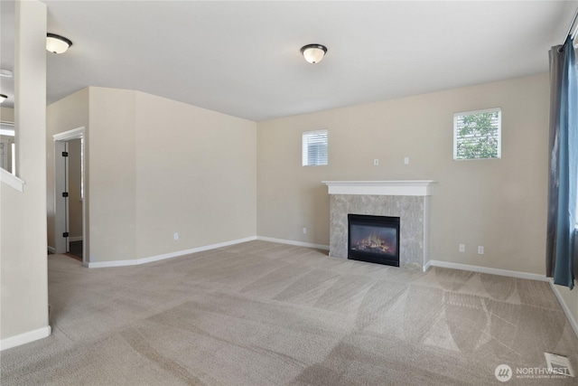 15309 91st Ave SE, Yelm, WA 98597 - unfurnished living room featuring carpet flooring and a tiled fireplace