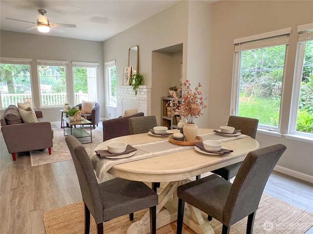 91 N Chandler Ct Unit D, Port Ludlow, WA 98365 - dining area with light wood-style flooring and a ceiling fan