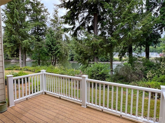91 N Chandler Ct Unit D, Port Ludlow, WA 98365 - wooden deck featuring a water view and view of wooded area