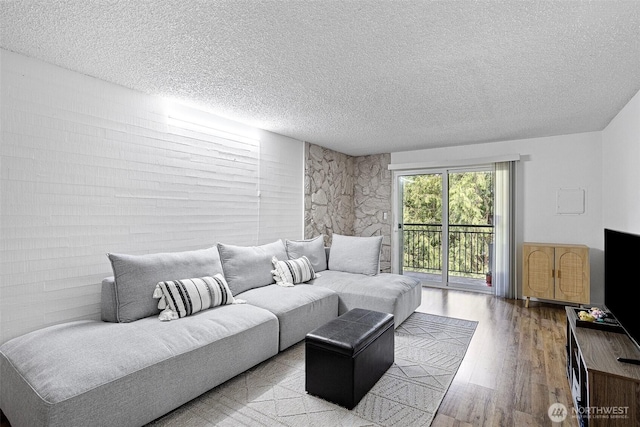 14760 NE 31st St Unit A307, Bellevue, WA 98007 - living room with a textured ceiling and wood finished floors