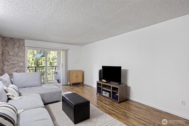 14760 NE 31st St Unit A307, Bellevue, WA 98007 - living area with a textured ceiling and wood finished floors