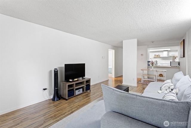 14760 NE 31st St Unit A307, Bellevue, WA 98007 - living area with wood finished floors and a textured ceiling
