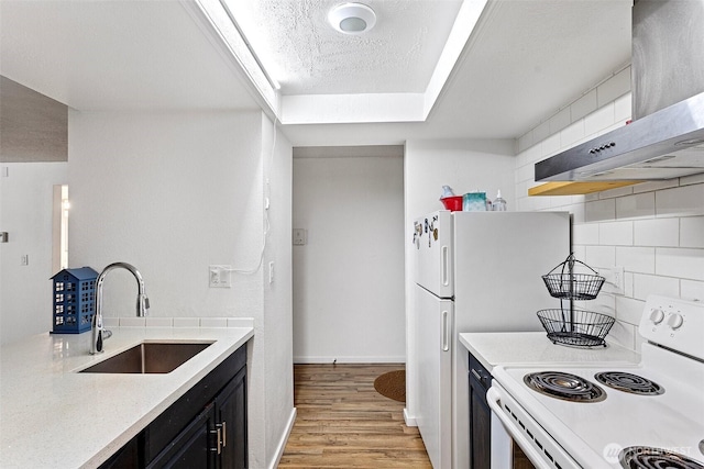 14760 NE 31st St Unit A307, Bellevue, WA 98007 - kitchen featuring white electric stove, exhaust hood, light wood-type flooring, light countertops, and decorative backsplash