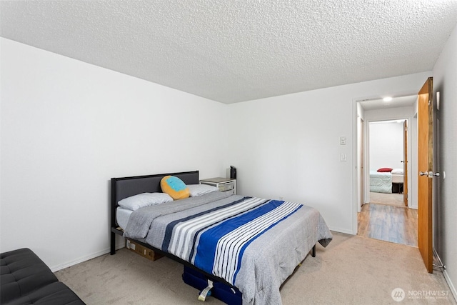 14760 NE 31st St Unit A307, Bellevue, WA 98007 - bedroom featuring carpet and a textured ceiling