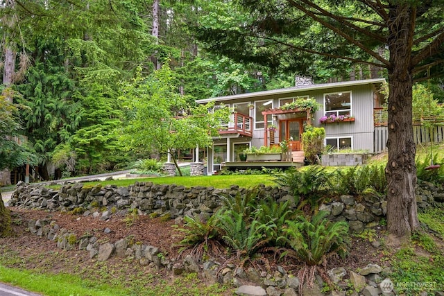 400 Sudden Valley Dr, Bellingham, WA 98229 - bi-level home featuring a wooden deck and a chimney