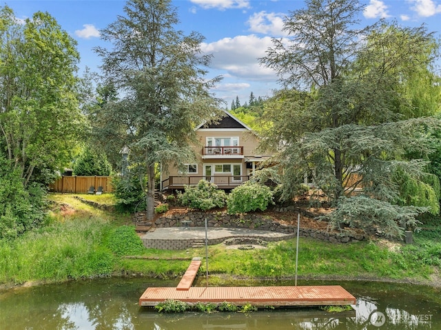 11028 E Riverside Dr, Bothell, WA 98011 - back of property featuring a balcony and a deck with water view
