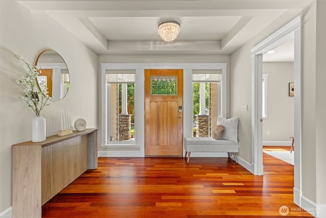 11028 E Riverside Dr, Bothell, WA 98011 - foyer with wood finished floors, a tray ceiling, and a chandelier