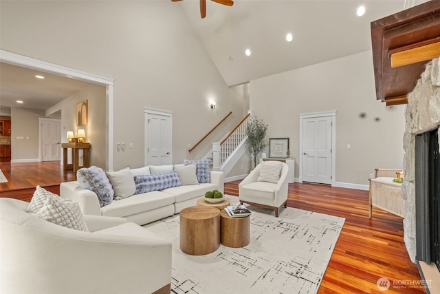 11028 E Riverside Dr, Bothell, WA 98011 - living area featuring high vaulted ceiling, stairs, a ceiling fan, recessed lighting, and wood finished floors