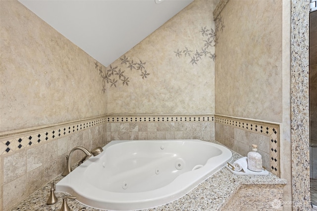 11028 E Riverside Dr, Bothell, WA 98011 - full bathroom featuring a tub with jets and vaulted ceiling