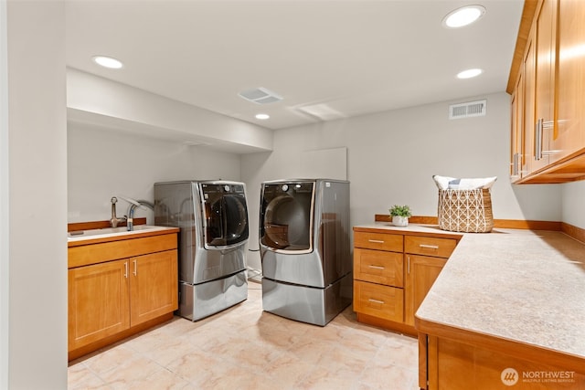 11028 E Riverside Dr, Bothell, WA 98011 - washroom with washing machine and dryer, cabinet space, and recessed lighting