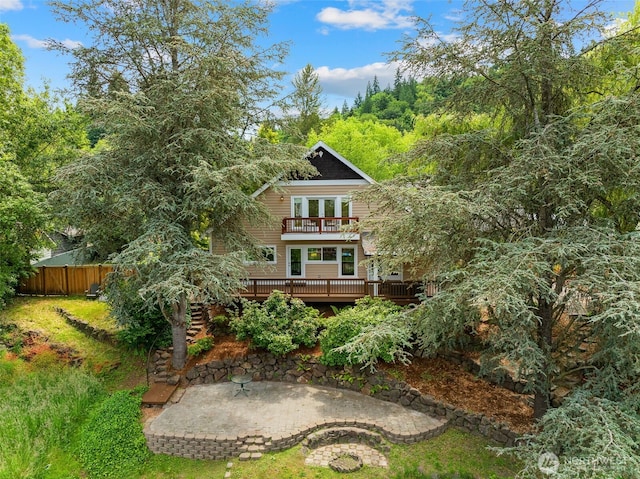 11028 E Riverside Dr, Bothell, WA 98011 - back of house featuring a balcony, a wooden deck, a patio, and french doors