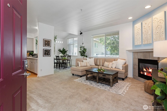 13000 Admiralty Way # D303, Everett, WA 98204 - living room with light carpet, a tile fireplace, recessed lighting, and vaulted ceiling