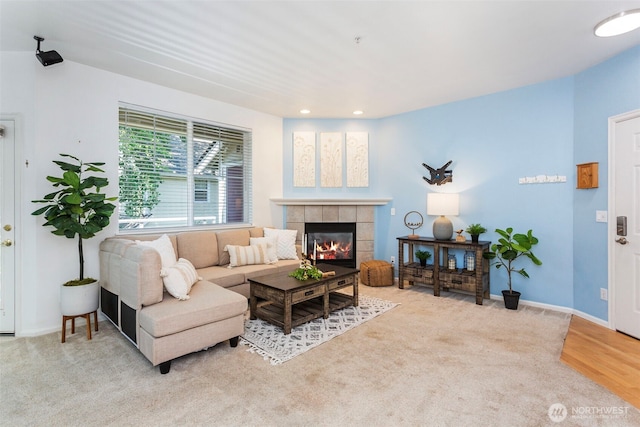 13000 Admiralty Way # D303, Everett, WA 98204 - living room with a tiled fireplace, recessed lighting, and light colored carpet