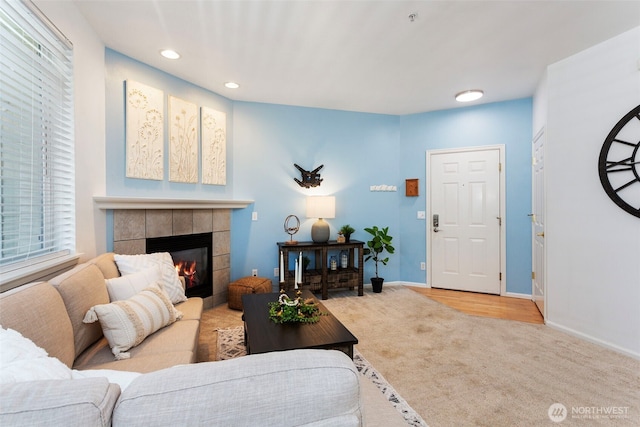 13000 Admiralty Way # D303, Everett, WA 98204 - carpeted living room featuring a tiled fireplace and recessed lighting