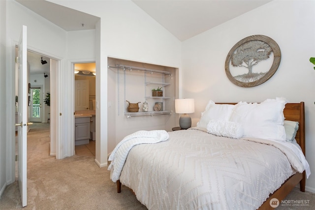 13000 Admiralty Way # D303, Everett, WA 98204 - bedroom featuring light colored carpet, lofted ceiling, and ensuite bath