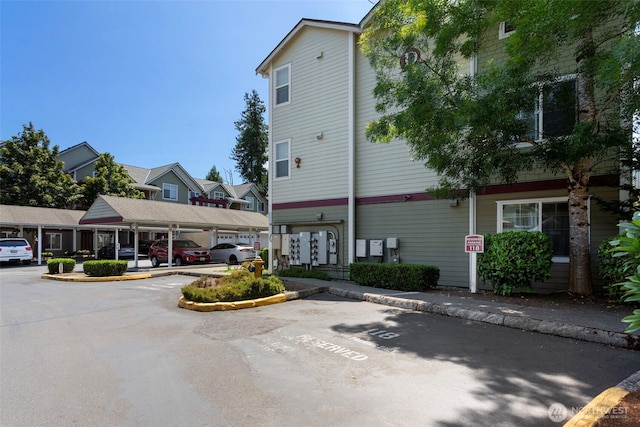 13000 Admiralty Way # D303, Everett, WA 98204 - view of building exterior featuring uncovered parking
