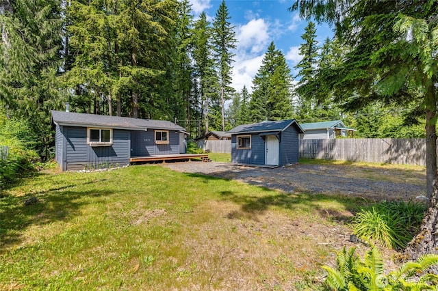 8471 Golden Valley Dr, Maple Falls, WA 98266 - view of yard featuring a wooden deck and a storage unit