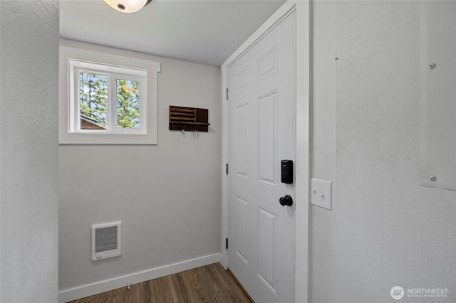 8471 Golden Valley Dr, Maple Falls, WA 98266 - laundry area featuring wood finished floors and heating unit
