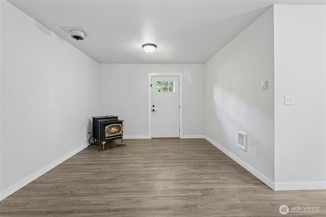 8471 Golden Valley Dr, Maple Falls, WA 98266 - foyer featuring a wood stove and wood finished floors