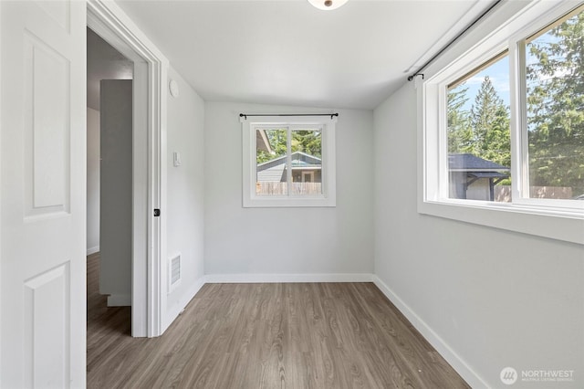 8471 Golden Valley Dr, Maple Falls, WA 98266 - spare room featuring wood finished floors, vaulted ceiling, and a smoke detector