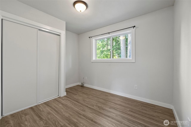 8471 Golden Valley Dr, Maple Falls, WA 98266 - unfurnished bedroom with wood finished floors and a closet