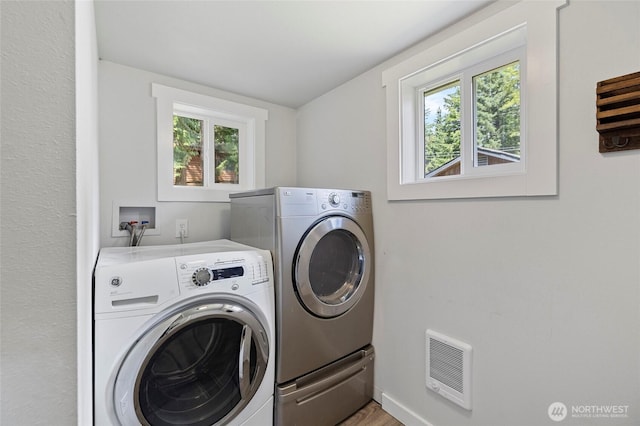 8471 Golden Valley Dr, Maple Falls, WA 98266 - laundry area featuring washer and dryer, heating unit, and light wood finished floors