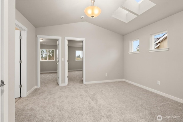 2883 74th Ln SW Unit Lot105, Tumwater, WA 98512 - unfurnished bedroom with a skylight, carpet flooring, vaulted ceiling, and a spacious closet