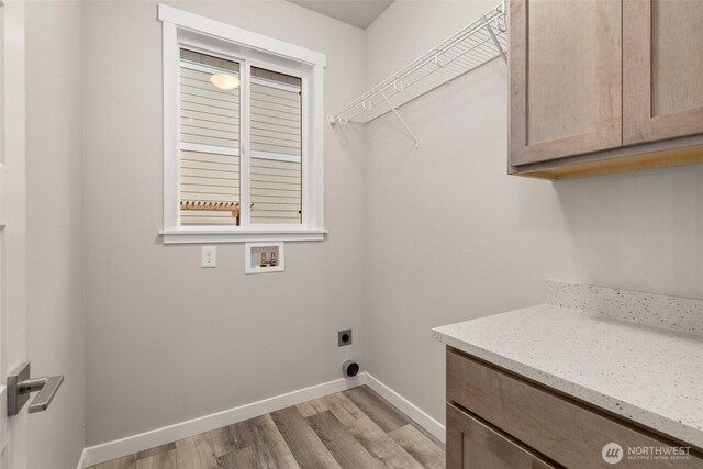 2883 74th Ln SW Unit Lot105, Tumwater, WA 98512 - laundry area featuring hookup for a washing machine, light wood-style flooring, electric dryer hookup, and cabinet space