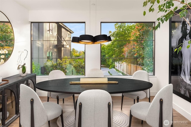 7826 115th Pl NE, Kirkland, WA 98033 - dining area featuring wood finished floors and healthy amount of natural light