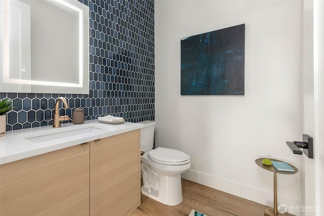 7826 115th Pl NE, Kirkland, WA 98033 - bathroom with vanity, wood finished floors, and backsplash
