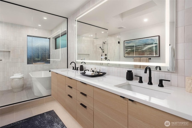 7826 115th Pl NE, Kirkland, WA 98033 - full bath featuring tile walls, double vanity, a freestanding bath, a tile shower, and tile patterned floors
