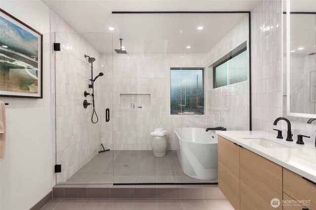 7826 115th Pl NE, Kirkland, WA 98033 - full bath with a stall shower, vanity, a freestanding tub, tile walls, and tile patterned floors