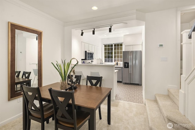 1900 132nd Ave SE Unit I-23, Bellevue, WA 98005 - dining space with recessed lighting, light colored carpet, crown molding, and stairs