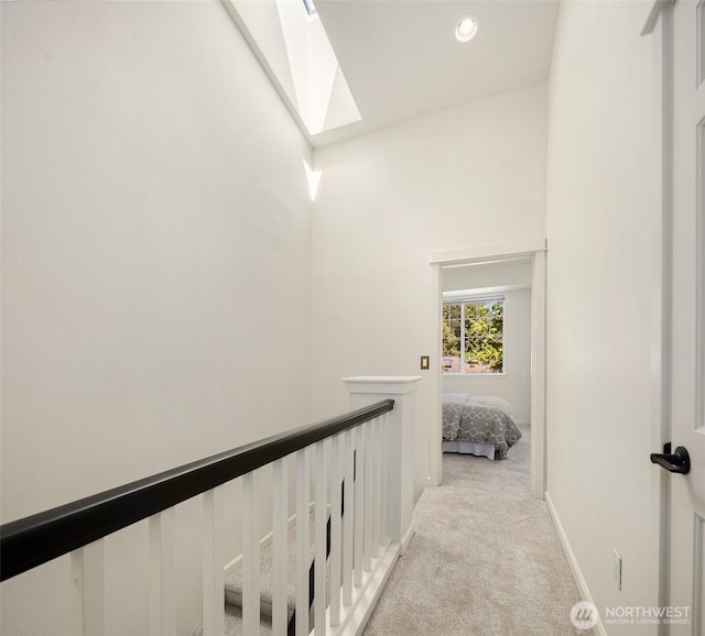 1900 132nd Ave SE Unit I-23, Bellevue, WA 98005 - hallway featuring light colored carpet and a skylight