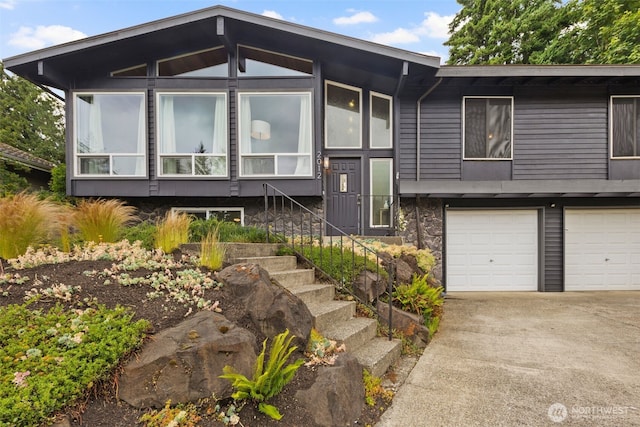 2012 SE 18th Ct, Renton, WA 98055 - view of front facade with concrete driveway, a garage, and stairway