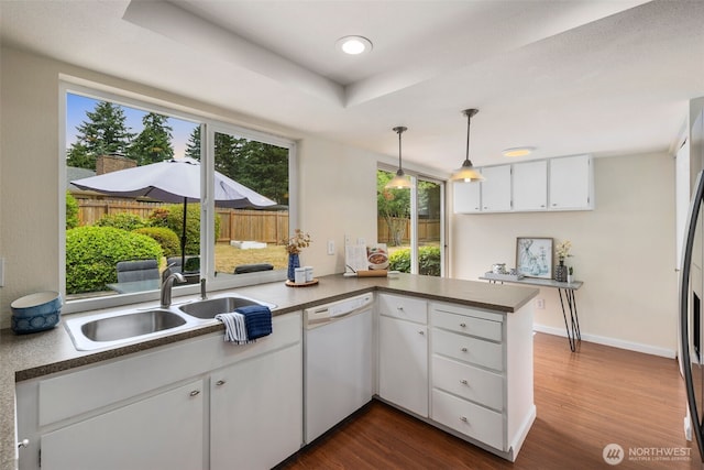 2012 SE 18th Ct, Renton, WA 98055 - kitchen featuring dishwasher, a peninsula, dark wood finished floors, white cabinetry, and recessed lighting