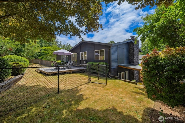 2012 SE 18th Ct, Renton, WA 98055 - rear view of house featuring a chimney and a patio