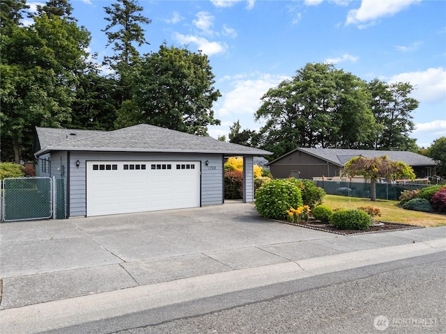 1708 24th Ct, Anacortes, WA 98221 - view of front of house featuring roof with shingles, a garage, and a gate