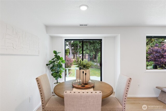 1708 24th Ct, Anacortes, WA 98221 - dining area with light wood-style floors and baseboards