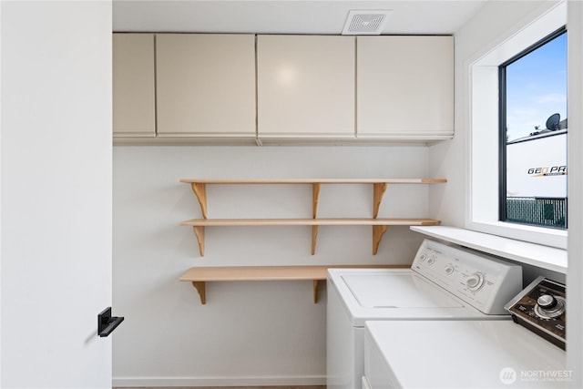 1708 24th Ct, Anacortes, WA 98221 - laundry room with washing machine and dryer and cabinet space