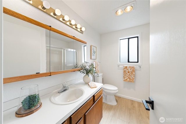 1708 24th Ct, Anacortes, WA 98221 - full bath with vanity, a stall shower, and wood finished floors