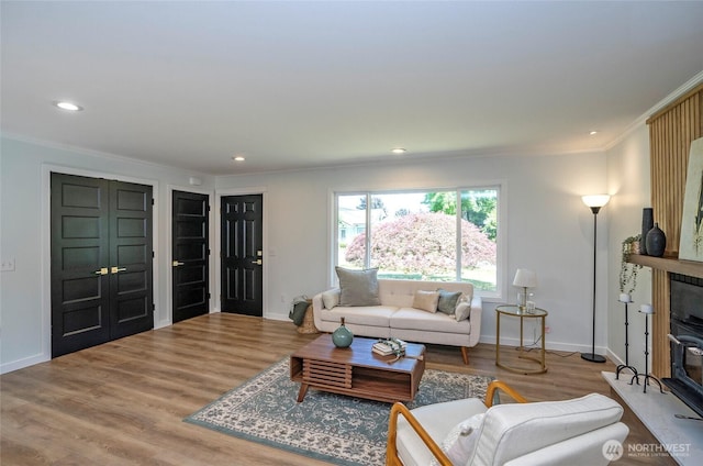 15512 Elm St E, Sumner, WA 98390 - living area with crown molding, wood finished floors, and recessed lighting