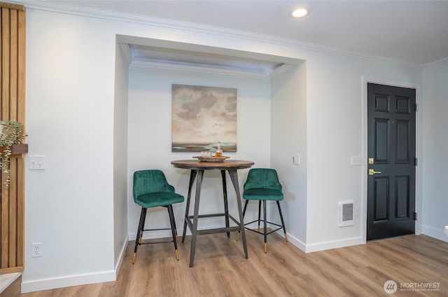 15512 Elm St E, Sumner, WA 98390 - dining area featuring wood finished floors, ornamental molding, recessed lighting, and heating unit