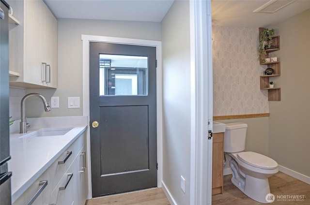 15512 Elm St E, Sumner, WA 98390 - entryway with a sink and light wood-style flooring