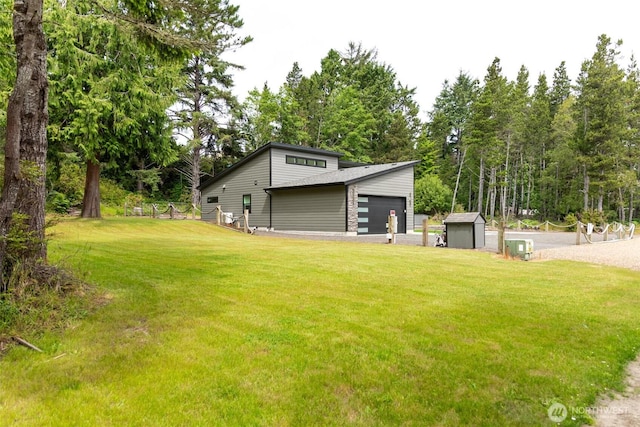 29813 L Ln, Ocean Park, WA 98640 - view of side of home featuring a yard, a garage, a shed, and view of wooded area