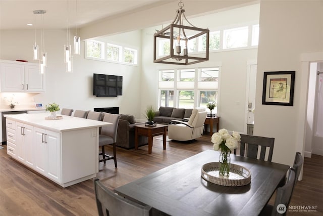 29813 L Ln, Ocean Park, WA 98640 - dining area with a towering ceiling, wood finished floors, plenty of natural light, and a chandelier