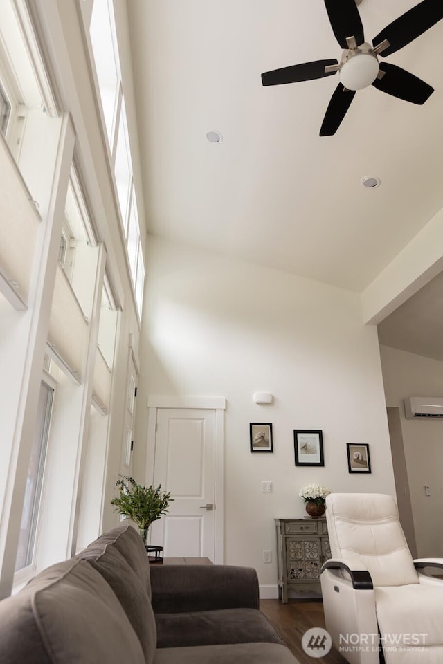 29813 L Ln, Ocean Park, WA 98640 - living room featuring a high ceiling, ceiling fan, a wall mounted AC, dark wood-type flooring, and recessed lighting