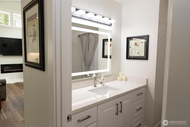 29813 L Ln, Ocean Park, WA 98640 - bathroom featuring vanity, wood finished floors, and a shower with shower curtain