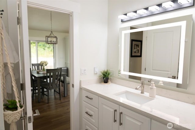 29813 L Ln, Ocean Park, WA 98640 - bathroom with vanity, wood finished floors, and a chandelier