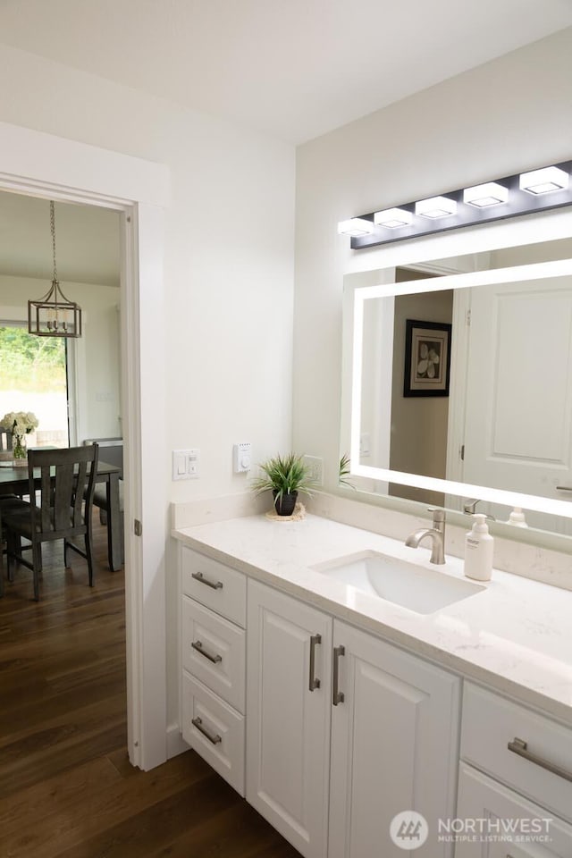 29813 L Ln, Ocean Park, WA 98640 - bathroom with vanity, wood finished floors, and a chandelier